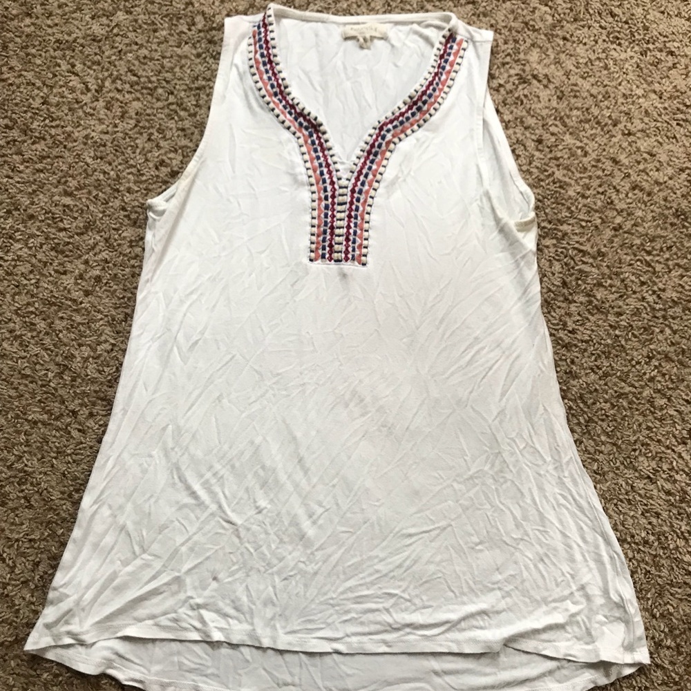 Sleeveless top with embroidery around neckline